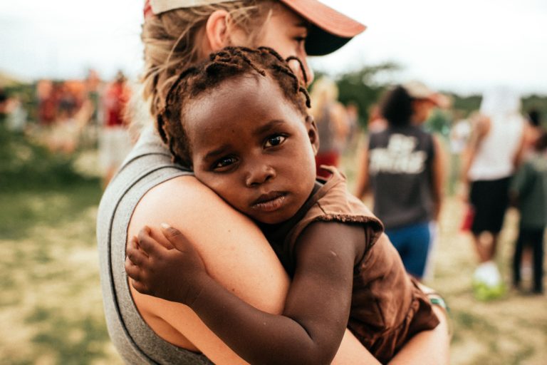 Volunteer holding a child