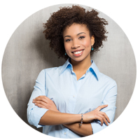 Female Afro Copywriter smiling at camera with arms crossed