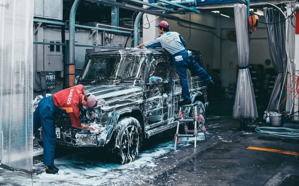 car wash employees washing a car