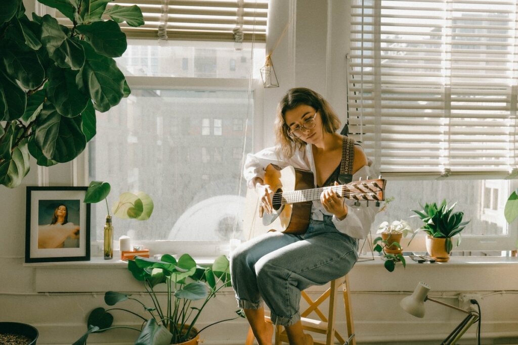 girl playing gitar